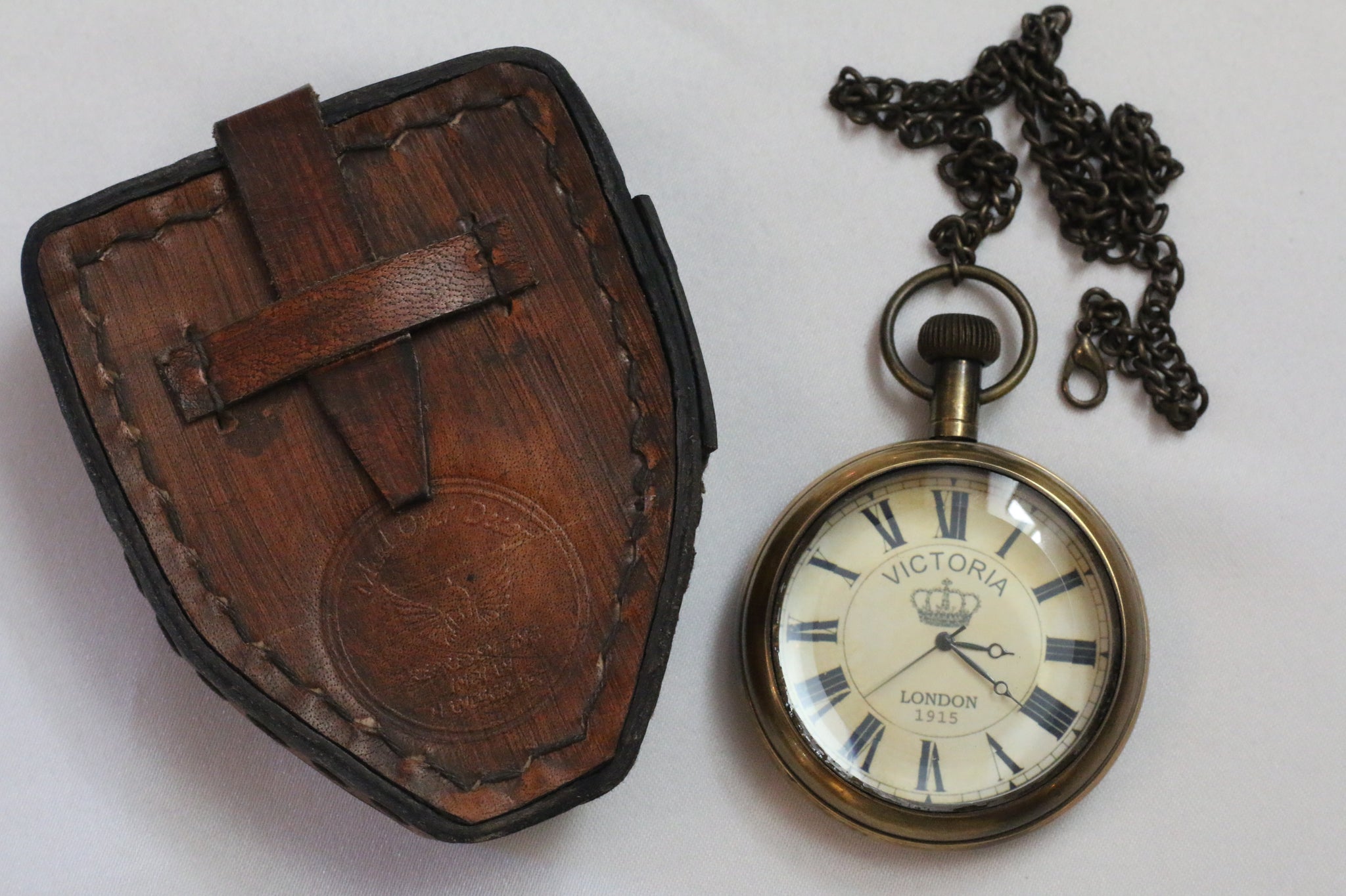 Royal navy antique style brass pocket watch with leather case Bygone Days Eclectic Emporium